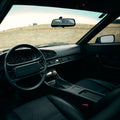 Porsche 944 interior featuring a wooden gear shift knob made of layered wood