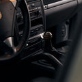 wooden shift knob with wenge and oak layers in an Porsche Cayenne